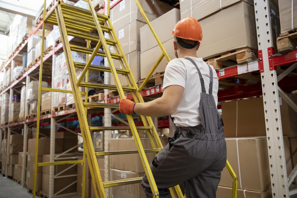 man climbing up ladder